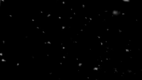 Snow-flakes-overlay-Winter,-slowly-falling-snow-effect-Dust-particles-seamless-loop-on-black-background.